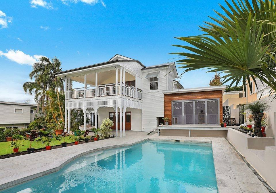 A contemporary home with a swimming pool and garden